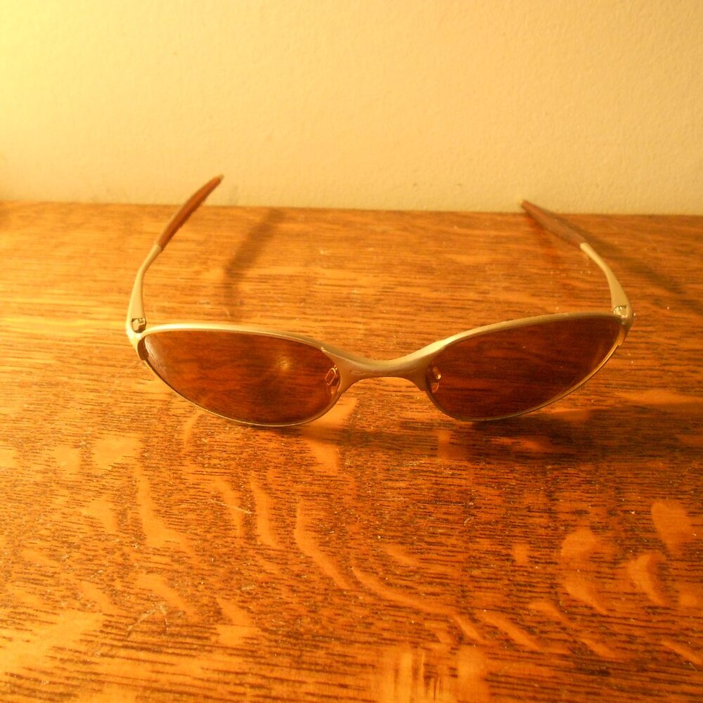 Oakley tan frame sunglasses